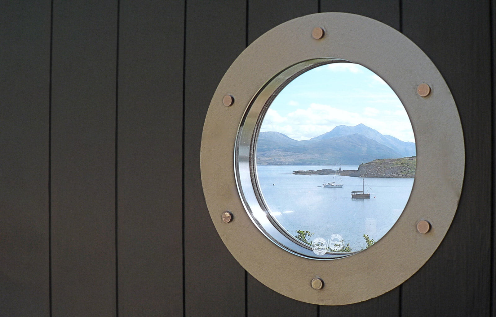 Through the Cabin's porthole window to the Sound of Sleat