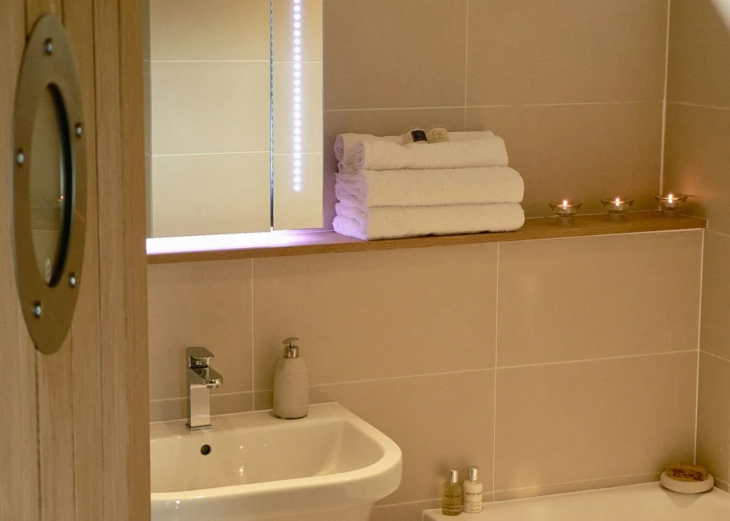 The main bathroom has a full-size bath and separate shower